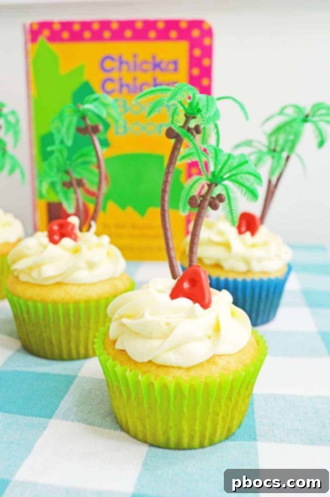 Chicka Boom Alphabet Treats 2 A vibrant Chicka Chicka Boom Boom cupcake with colorful candy letters and a small palm tree topper, ready to be enjoyed after reading time.