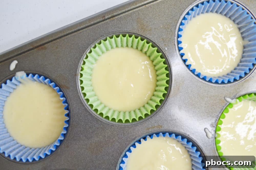 Chicka Boom Alphabet Treats 5 Freshly baked cupcakes cooling on a wire rack after being removed from the oven.