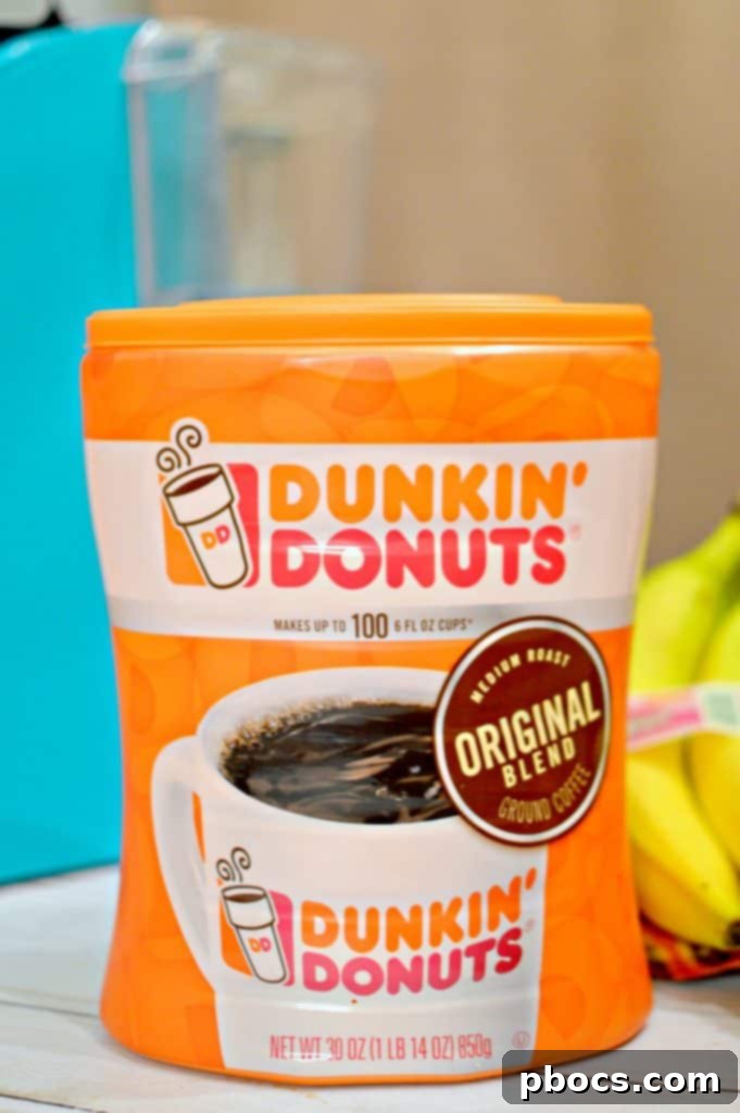 Dunkin' Donuts 30oz Coffee Canister Dunkin' Donuts 30oz Original Blend coffee canister on a kitchen counter