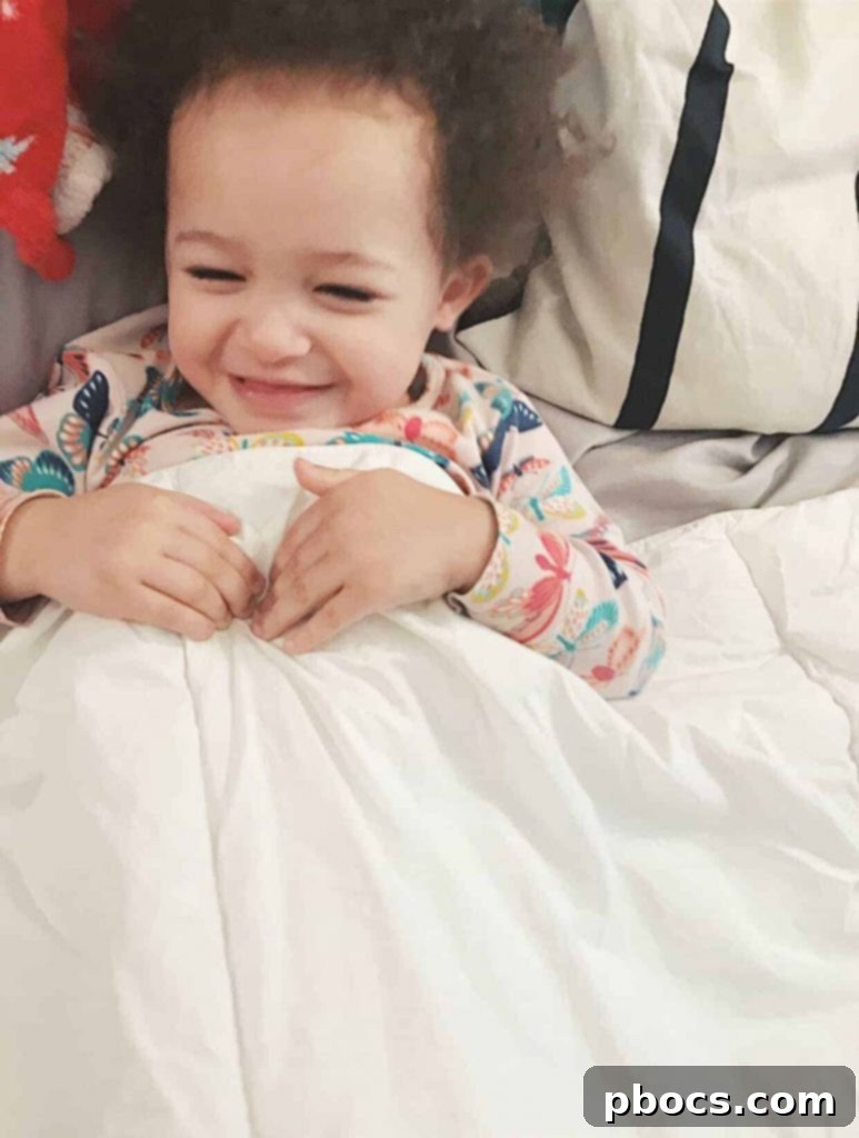 Toddler and baby ready for bed with their comfort items