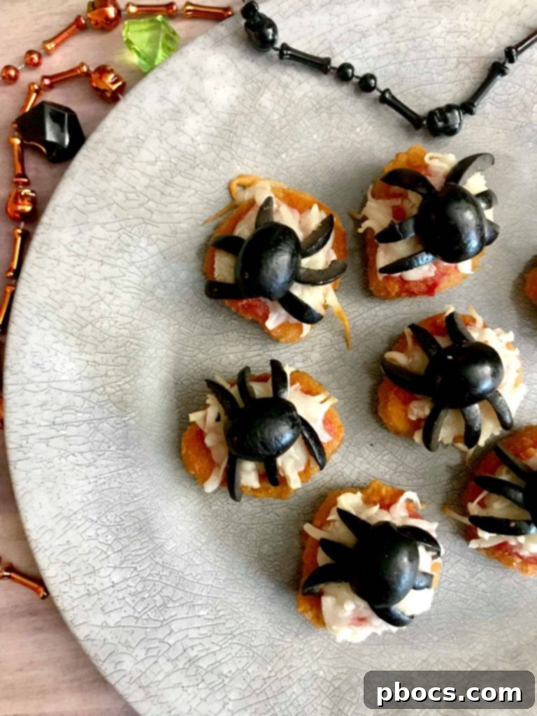 Delicious Halloween Chicken Nugget Spider Bites on a plate, ready to be served.