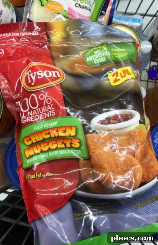 Close-up of a perfectly crafted Halloween chicken nugget spider bite with olives.