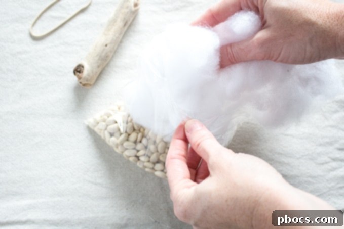 Adding Polyester Stuffing to Pumpkin Core