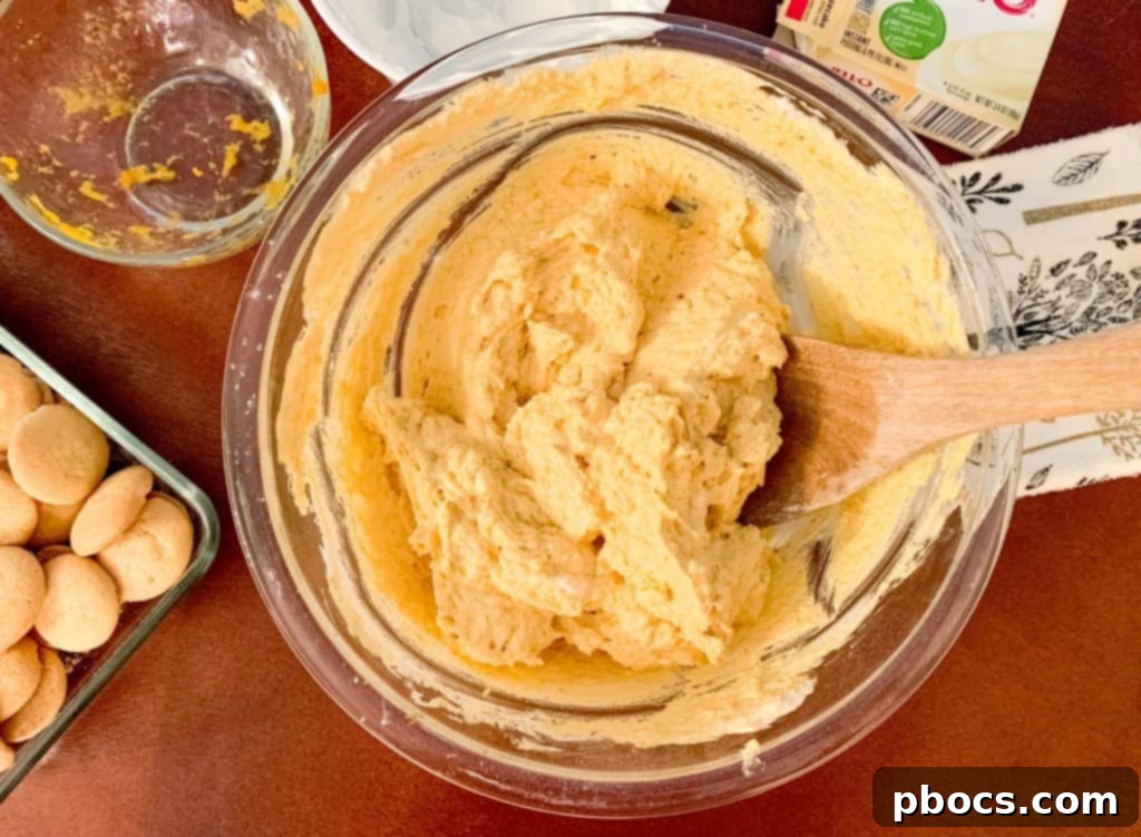 Mixing the pumpkin dip ingredients for creamy consistency