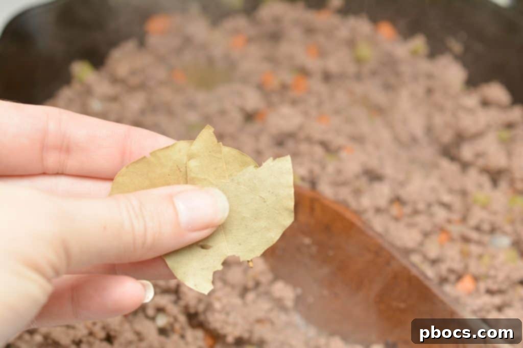 A bowl of Keto Spaghetti Bolognese with zucchini noodles and Parmesan