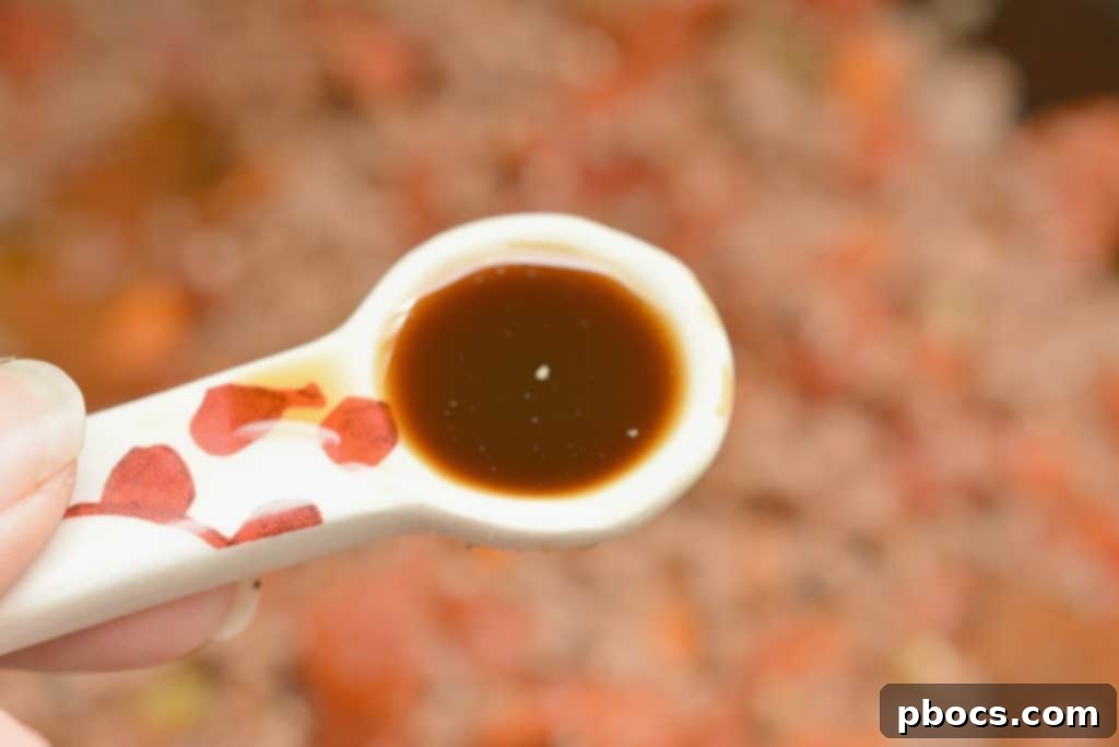 Mixing in Worcestershire sauce to the bolognese
