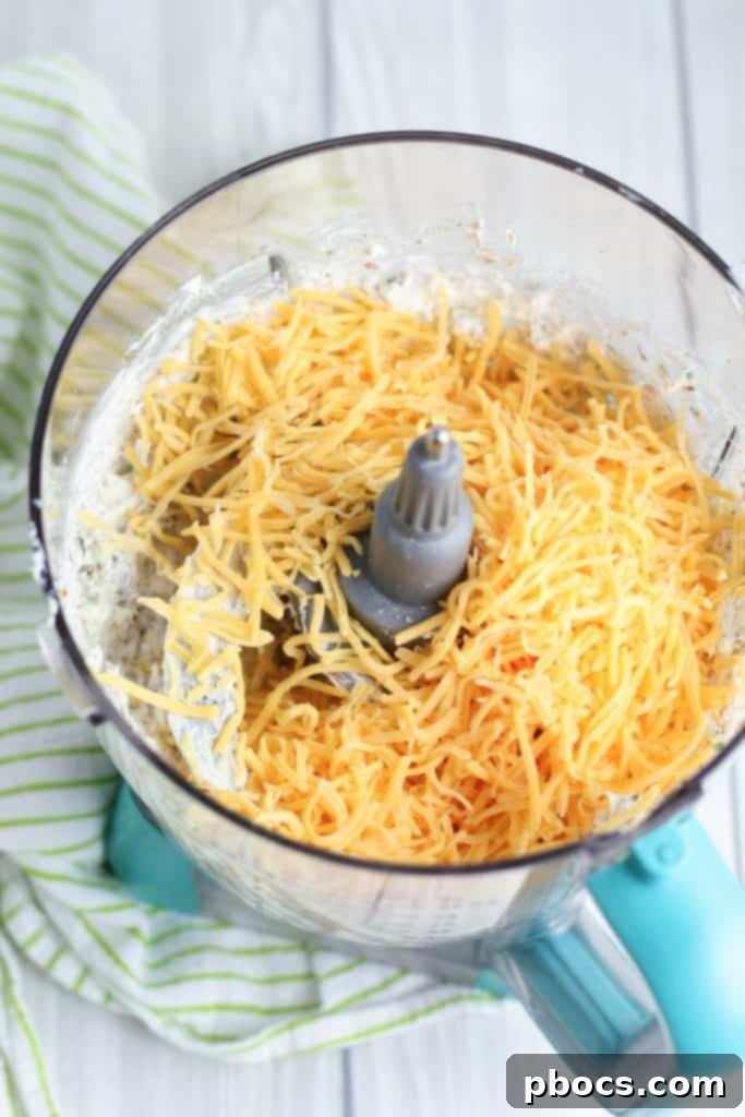 Cream cheese mixture with herbs and spices in a food processor