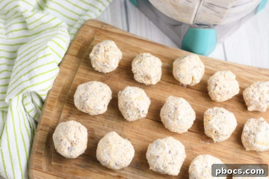 Cheddar cheese being added to the cream cheese mixture
