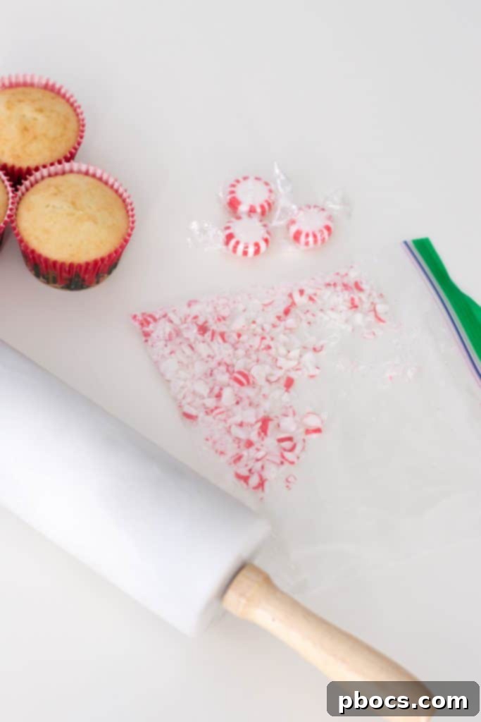 Effortless Peppermint Delights 7 Piping Peppermint Buttercream onto a Vanilla Cupcake