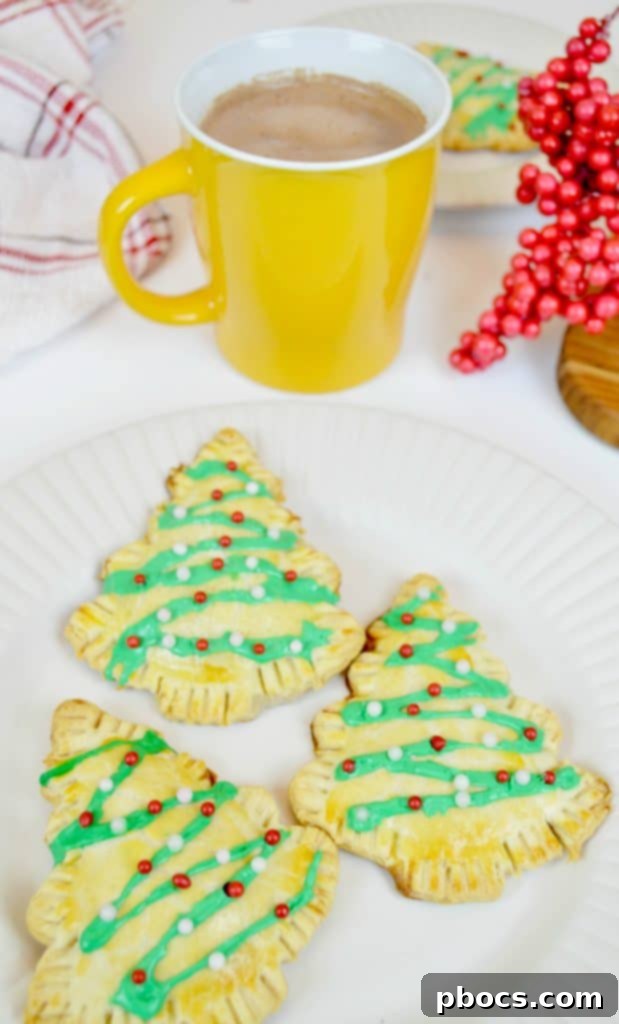 No-Fuss Festive Tree Treats 5 Festive Christmas tree pastries served with a cup of hot chocolate.