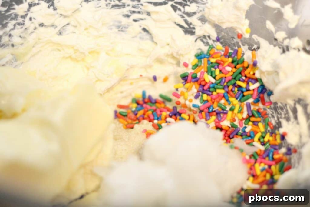 Keto Confetti Bliss Bites 4 Beating softened cream cheese for Keto Funfetti Fat Bombs