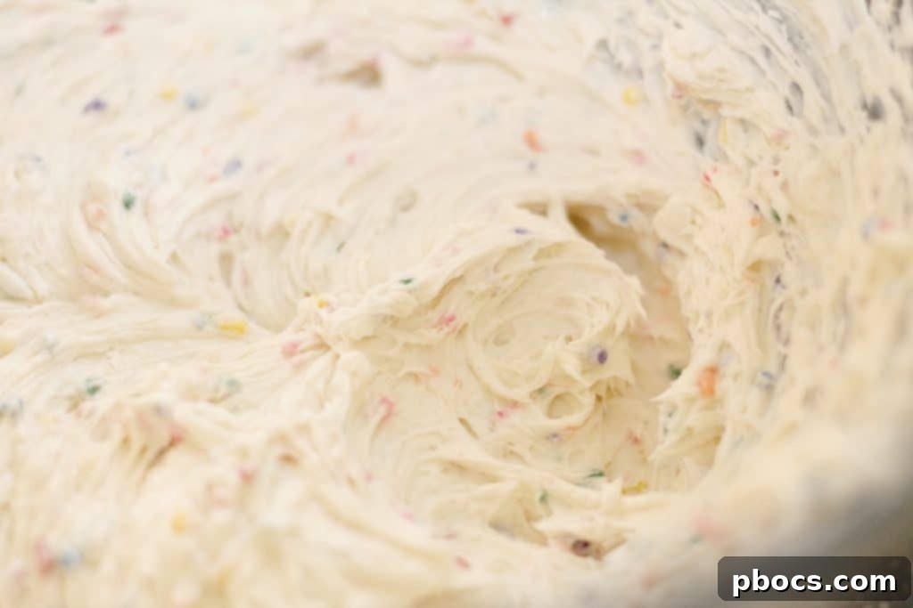 Keto Confetti Bliss Bites 5 Adding ingredients to cream cheese for Funfetti Fat Bombs