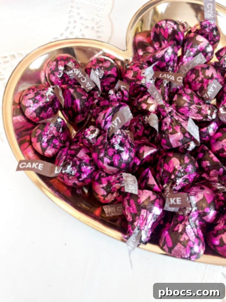 Homemade Valentine's Treat Dish 4 A generous handful of new HERSHEY'S Lava Cake Kisses chocolates, ready to fill a festive Valentine's Day candy dish.