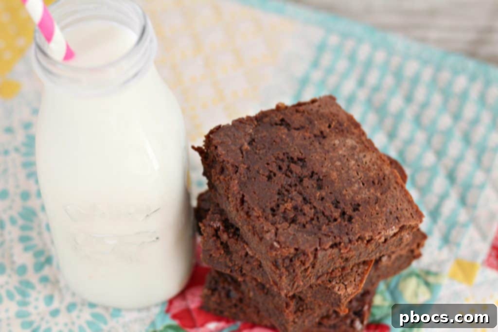 Fudgy Greek Yogurt Brownies 3 A close-up shot of freshly baked Greek yogurt brownies cooling in a square baking pan.