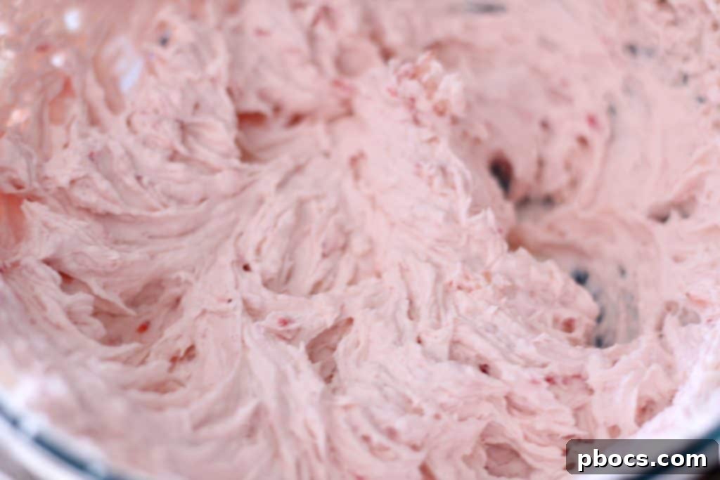 Mixing ingredients for Keto Strawberry Cheesecake Fat Bombs