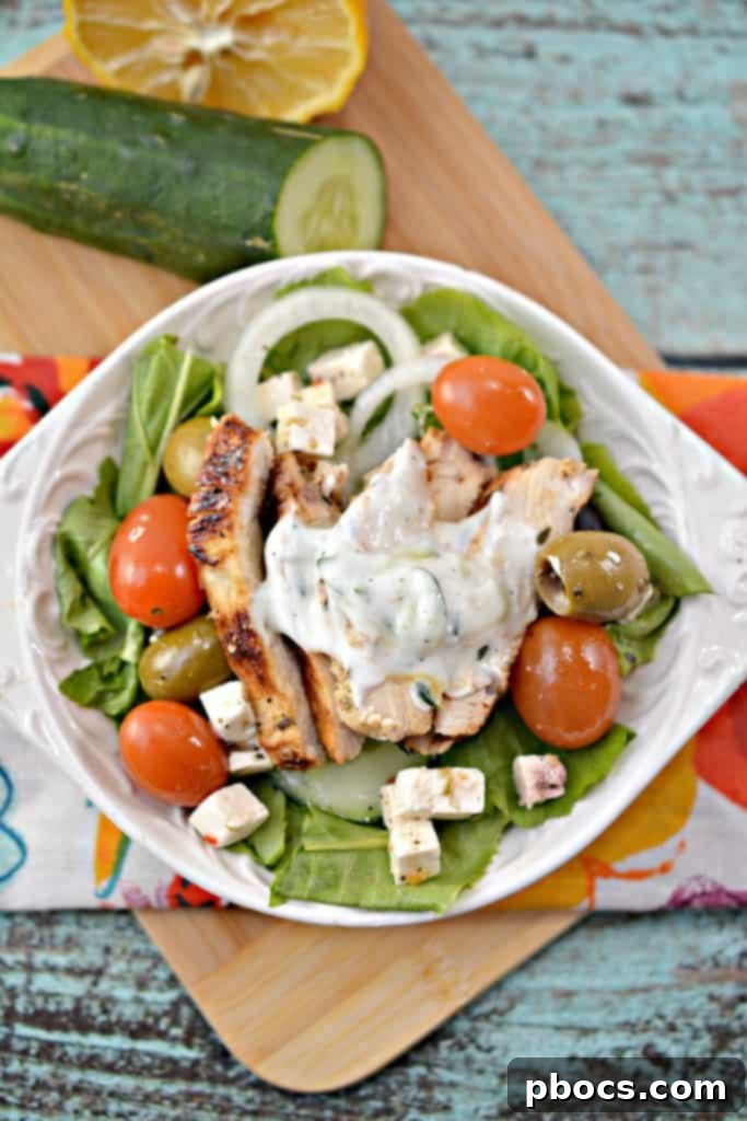 An appetizing overhead view of a Low Carb Greek Chicken Bowl, highlighting the colorful array of ingredients and healthy composition.