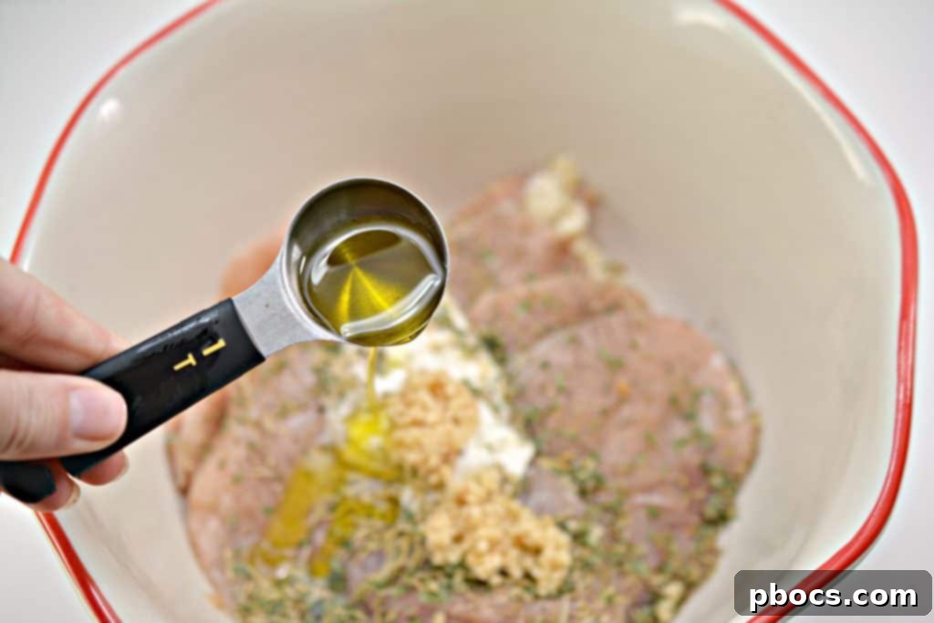 Seasoning the chicken marinade with salt and freshly ground black pepper.