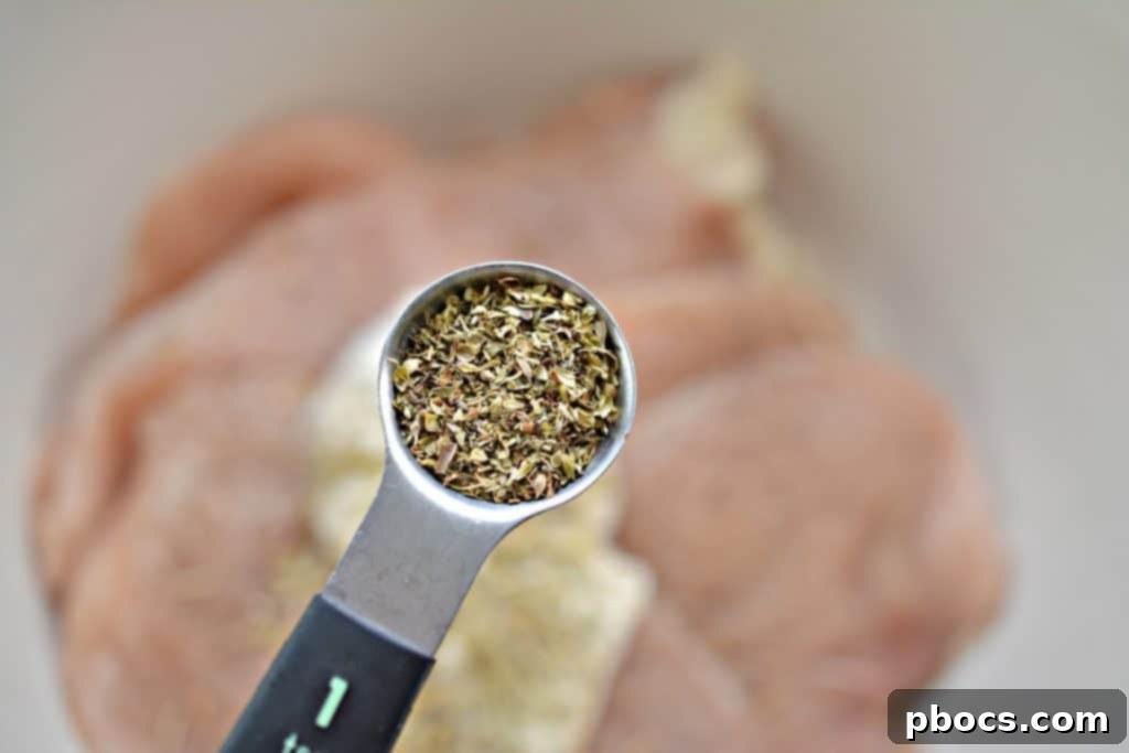 Incorporating dried oregano, thyme, and rosemary into the chicken marinade.