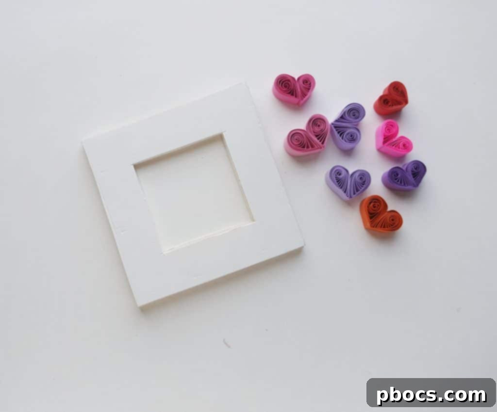 Collection of quilled heart shapes ready for frame decoration