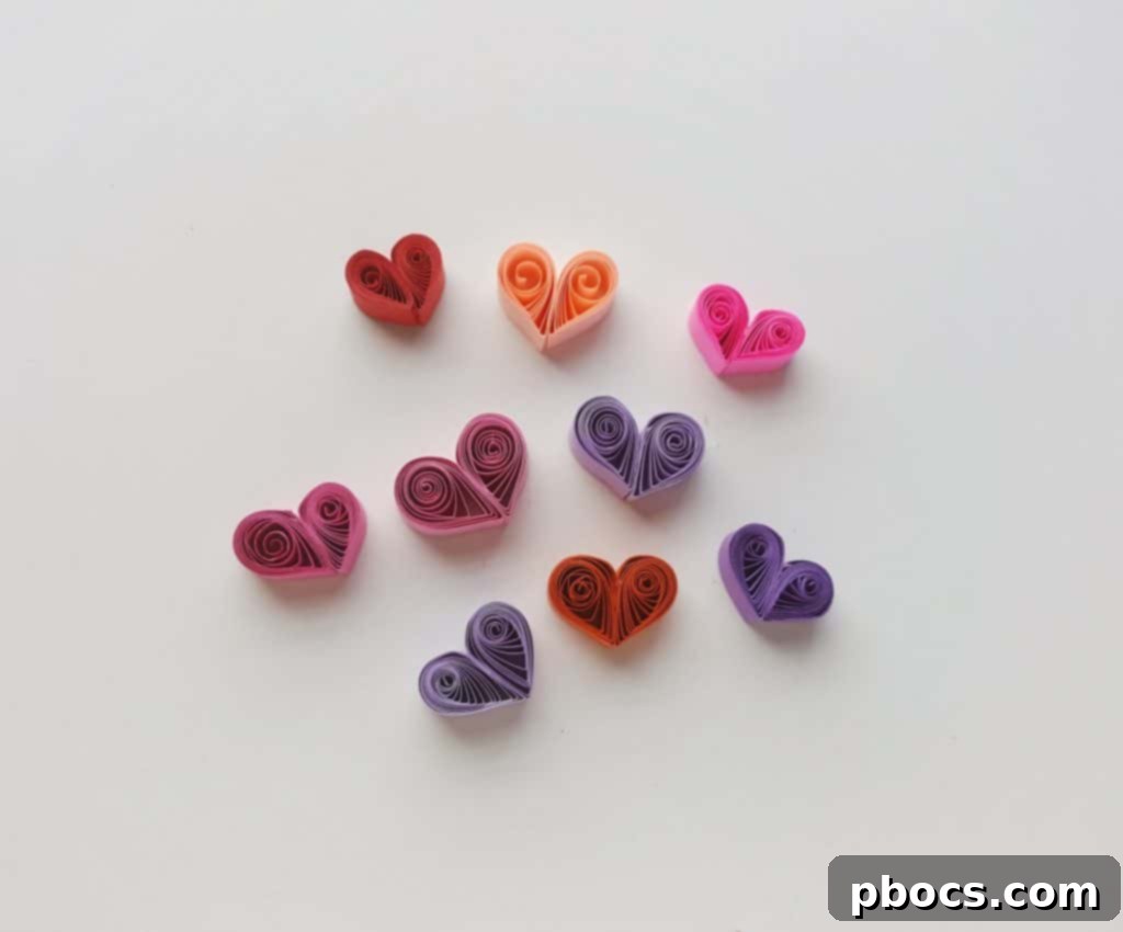 Gluing two teardrops to form a basic quilled heart shape