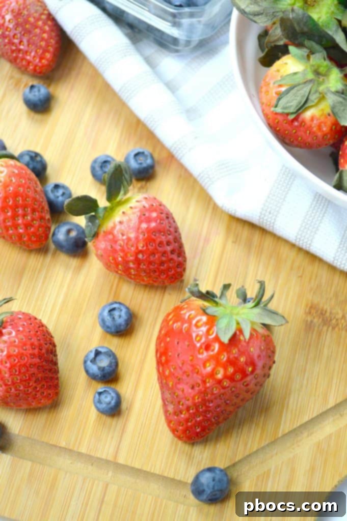 Vibrant Arugula Berry Citrus Salad 3 Close-up of fresh Florida strawberries in a bowl