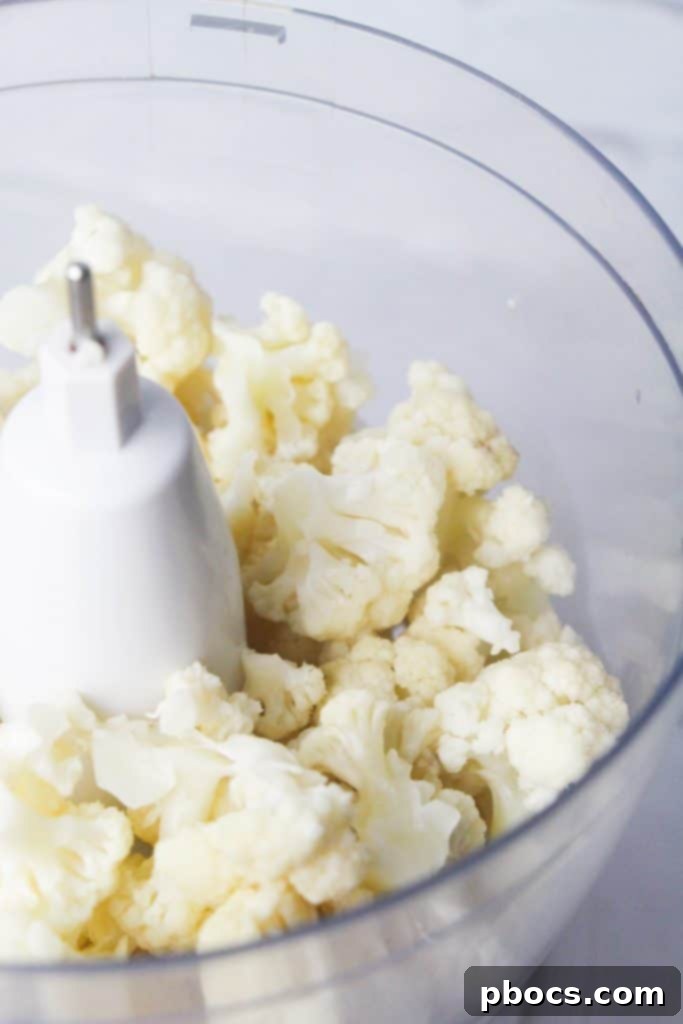 Creamy Keto Cauliflower Mash 6 Chopped cauliflower florets in a pot, ready for cooking for mashed potatoes.