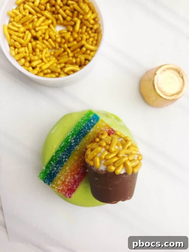 Close-up of fully decorated St. Patrick's Day OREO Cookies with a visible rainbow and pot of gold detail.