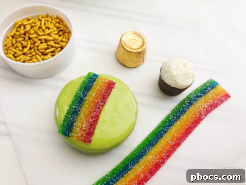 Freshly dipped green OREO cookies setting on parchment paper.