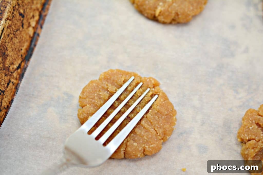 Raw keto peanut butter cookies on a baking sheet before baking