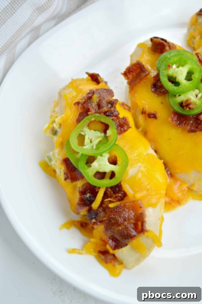 Explosive Jalapeno Popper Chicken 3 Sliced Jalapeno Popper Stuffed Chicken Breast Revealing Creamy Filling