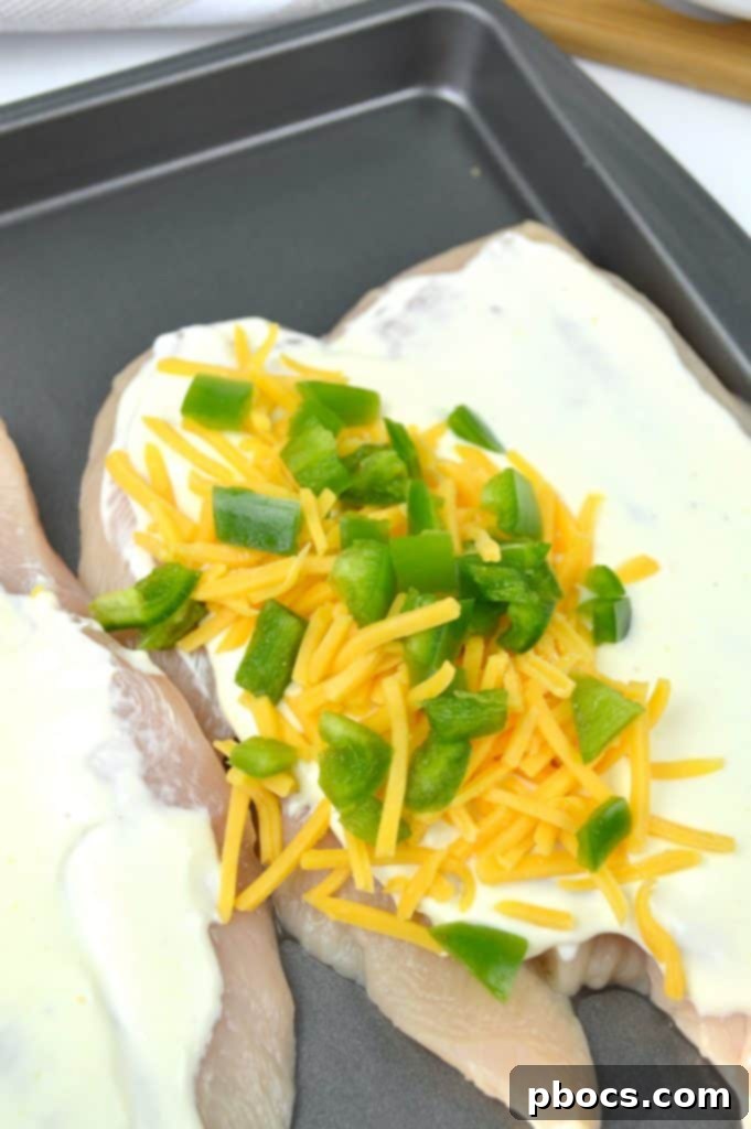 Explosive Jalapeno Popper Chicken 5 Jalapeno Popper Stuffed Chicken Baking with Melting Cheese