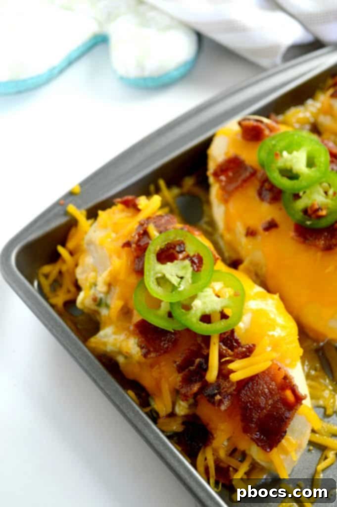 Explosive Jalapeno Popper Chicken 6 Close-up of Finished Jalapeno Popper Stuffed Chicken with Melted Cheese and Bacon