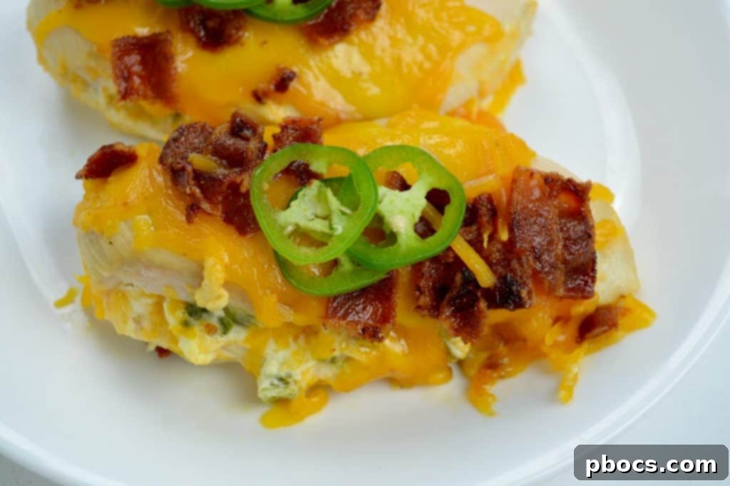 Explosive Jalapeno Popper Chicken 7 Plated Jalapeno Popper Stuffed Chicken with a Side of Greens