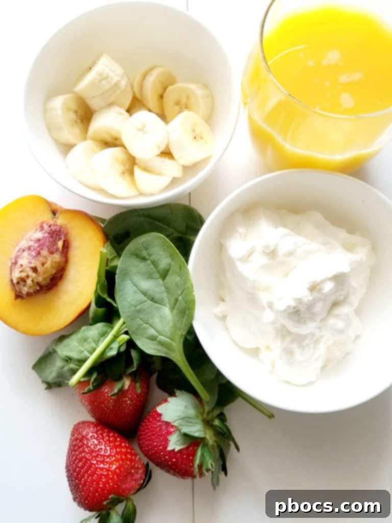 Gathering ingredients for a green smoothie: fresh spinach, Greek yogurt, strawberries, banana, peach, and orange juice
