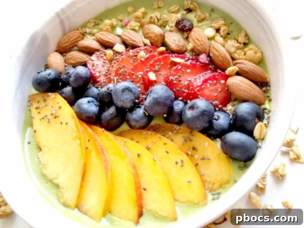 Freshly blended green smoothie being poured into a serving bowl