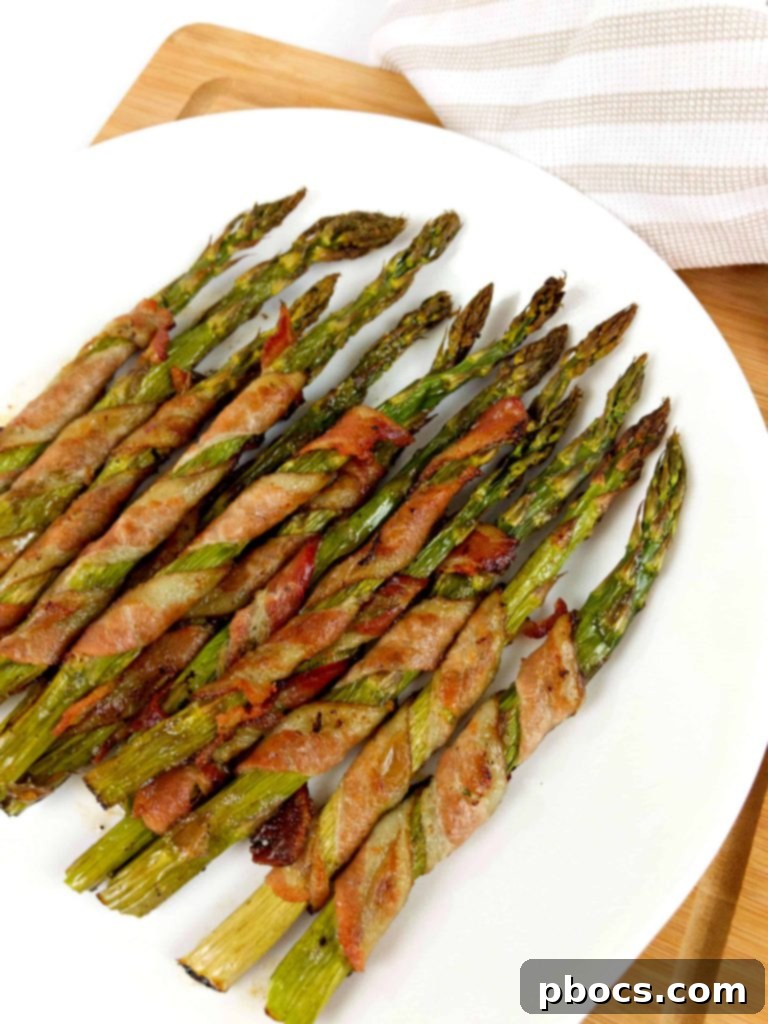 Keto Bacon Wrapped Asparagus served as an appetizer