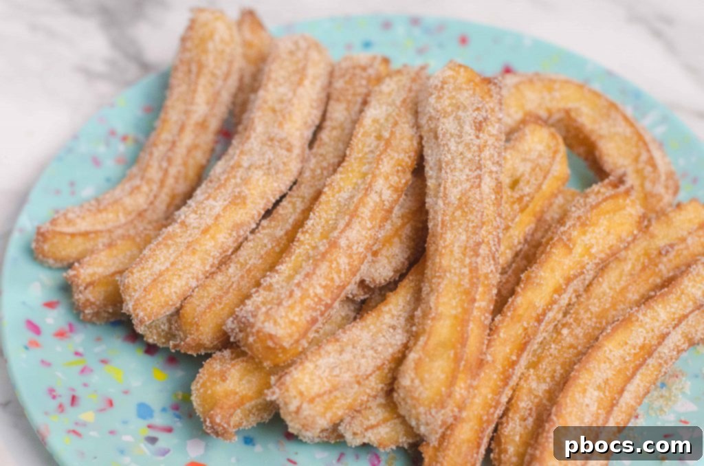 Quick Homemade Churros 3 Freshly fried churros with a side of dipping sauce