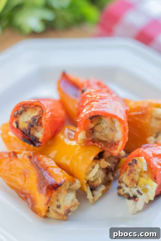 Stuffed sweet peppers baking in the oven, showing the golden cheese topping