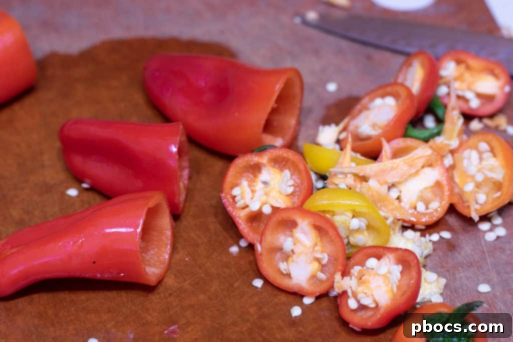 Preparing sweet peppers: Tops cut off and seeds removed