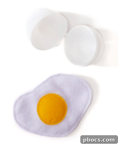 Four colorful felt eggs in plastic shells, neatly arranged in an egg carton, an ideal non-candy Easter basket filler.