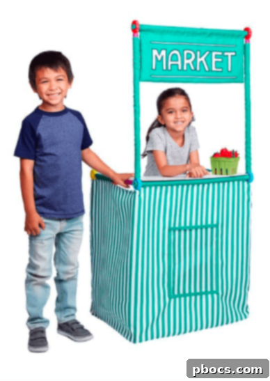 A child joyfully assembling a large structure with an Antsy Pants Build and Play kit, fostering creativity.