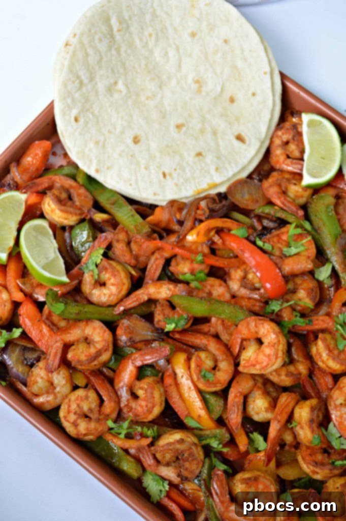 Sizzling Sheet Pan Shrimp Fajitas 2 Sizzling Sheet Pan Shrimp Fajitas with colorful Fresh From Florida bell peppers