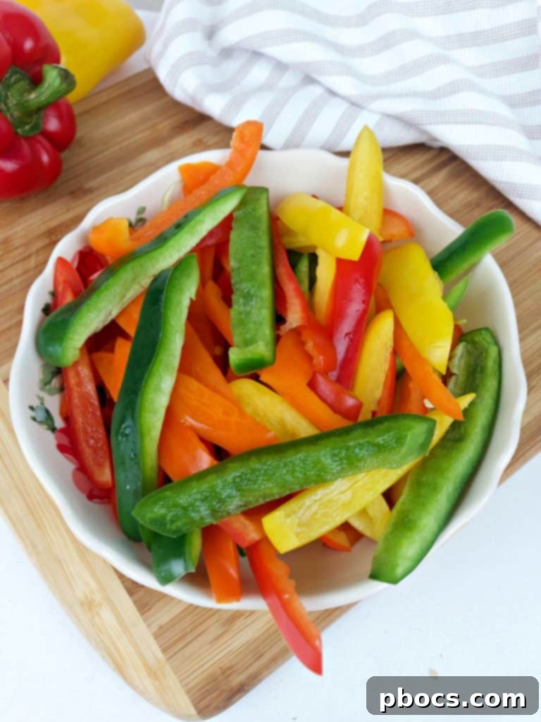 Sizzling Sheet Pan Shrimp Fajitas 6 Shrimp, bell peppers, and onion seasoned in a bowl