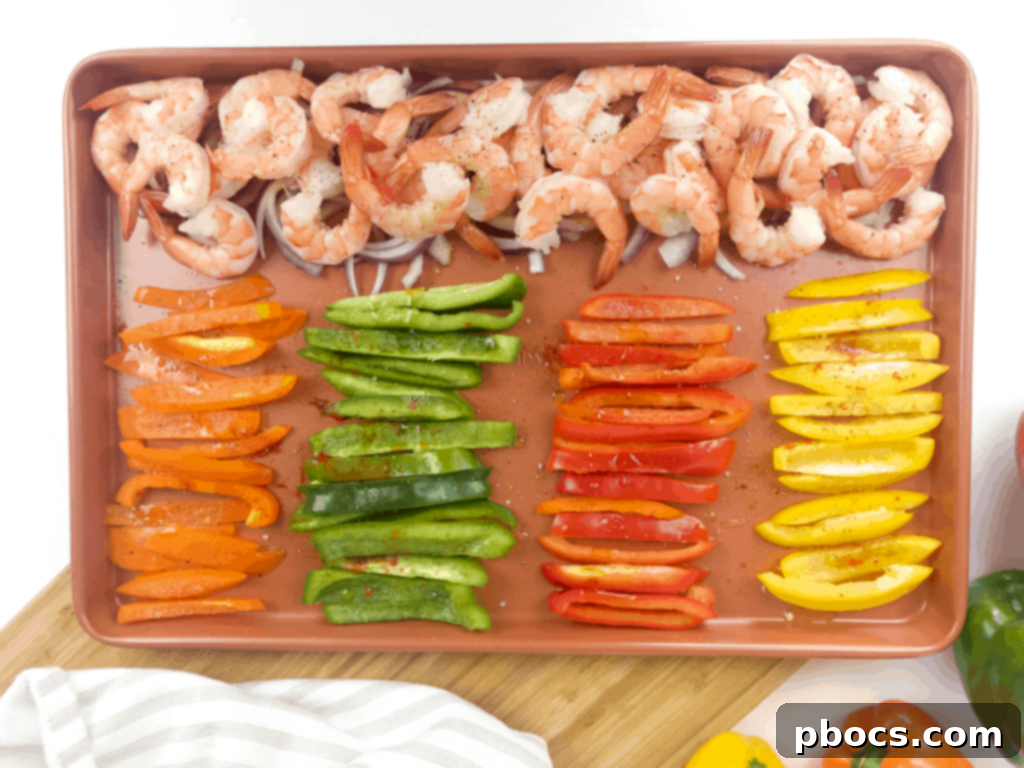 Sizzling Sheet Pan Shrimp Fajitas 7 Seasoned shrimp and vegetables spread on a sheet pan
