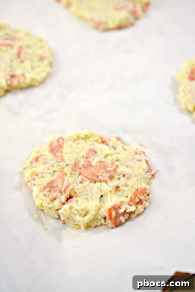 Step 6: Four rounds of cloud bread batter on a baking sheet