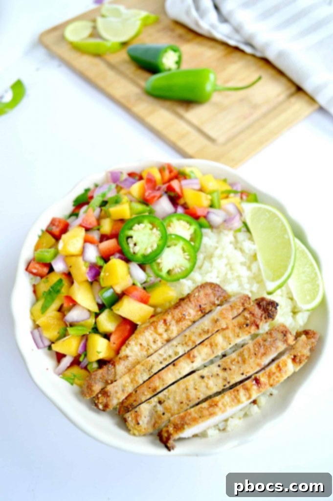 Grilled Pork Chops & Peach Salsa served on a plate