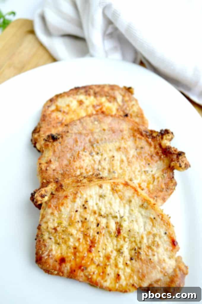 Close-up of a seasoned Smithfield pork chop on a cutting board