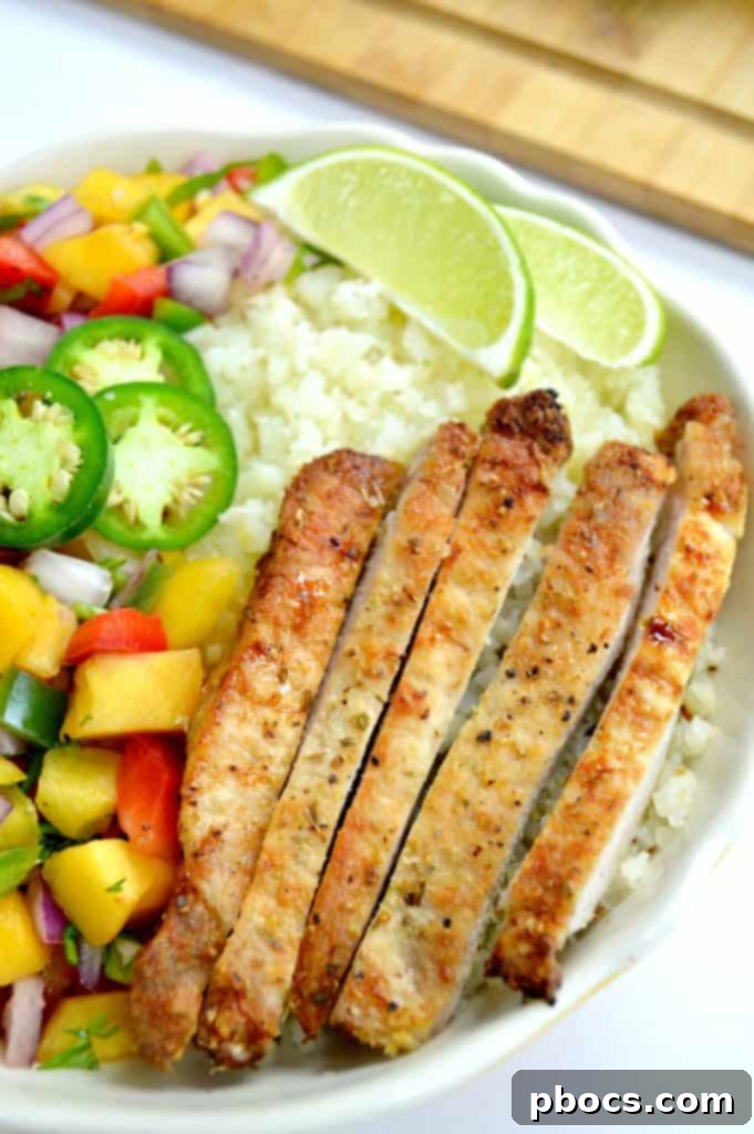Grilled Pork Chops & Peach Salsa bowl with cauliflower rice and avocado