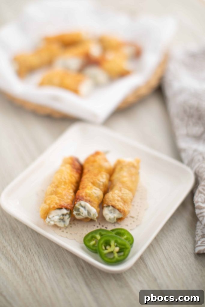 Dynamite Chicken Jalapeño Poppers 2 Irresistible Crispy Chicken Wrapped Jalapeno Poppers on a Platter