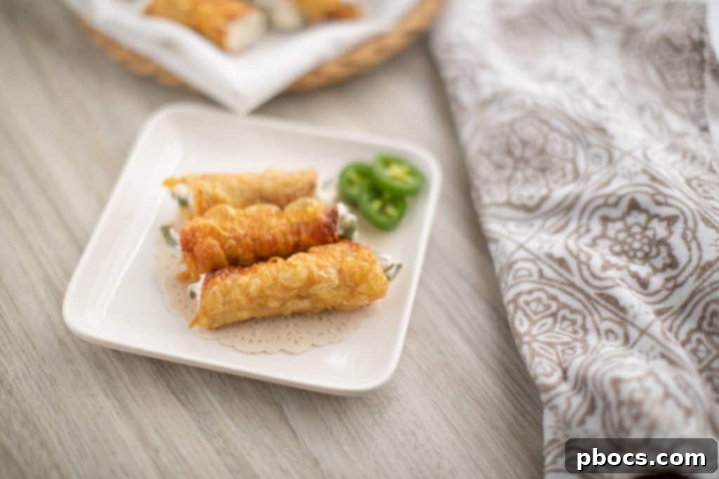 Dynamite Chicken Jalapeño Poppers 3 Close-up of Crispy Chicken Wrapped Jalapeno Poppers, Ready to Serve